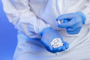 Medical production, worker inspects pill capsules with medicine quality in pharmaceutical facility