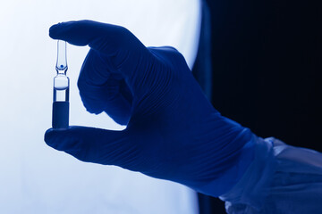 Scientist making Development and invention of vaccine medicine ampoule in pharmaceutical laboratory.