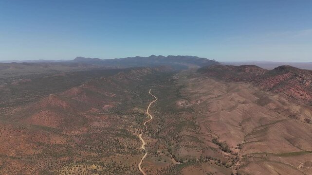 Brachina Gorge, South Australia &ndash; 4K Aerial Drone Footage of Geological Trail, Rugged Red Cliffs, Winding Dirt Road, Vast Valleys, Mountain Ridges, Rocky Terrain, Outback Landscape in Flinders Ranges