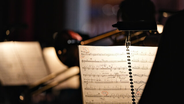 Close up of illuminated music sheet in orchestra before concert - Powered by Adobe