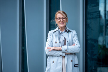 Confident senior business woman smiling professional standing proud