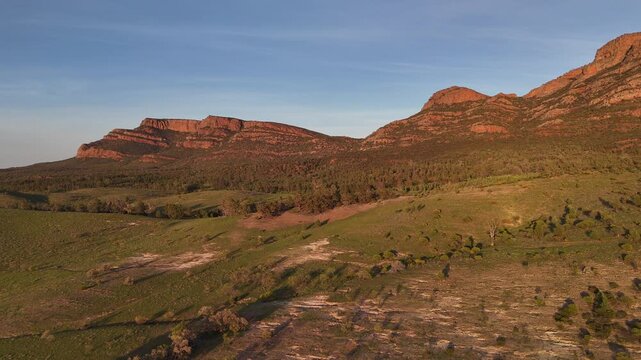 Flinders Ranges, South Australia at Sunrise &ndash; 4K Aerial Drone Footage of Rugged Mountains, Red Rocks, Green Valleys, and Golden Morning Light over the Outback Landscape