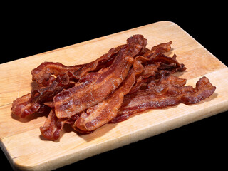 Crispy Bacon on a Wooden Cutting Board