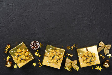 Golden gift boxes and decor on concrete background, top view