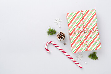 Striped Christmas gift boxes on color background, top view