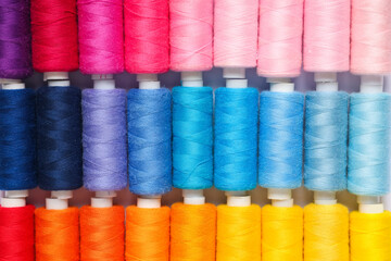 Colorful thread spools as background