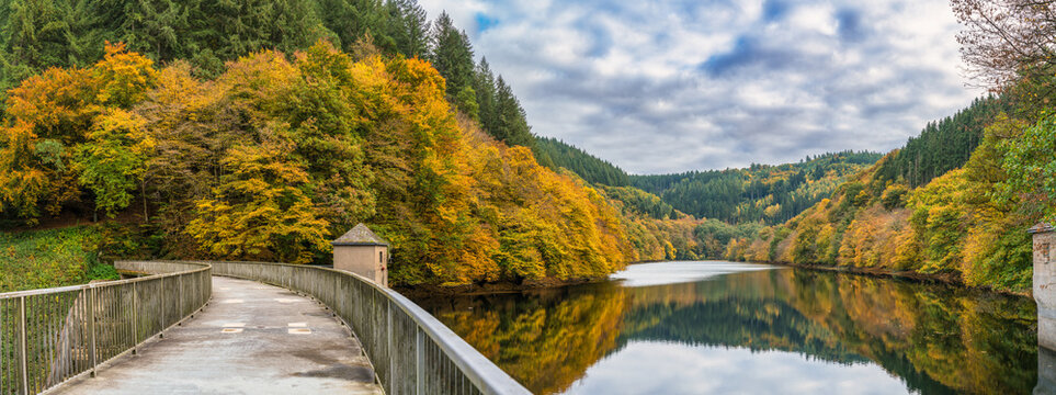 Water held in the Dhrontalsperre, a dam in Germany that provides water for the Kleine Dhron river and generates hydroelectric power. Autumn season. Germany