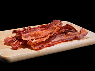Crispy Bacon on a Wooden Cutting Board