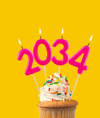Candle number 2034 for happy new year - New years eve celebration on yellow background