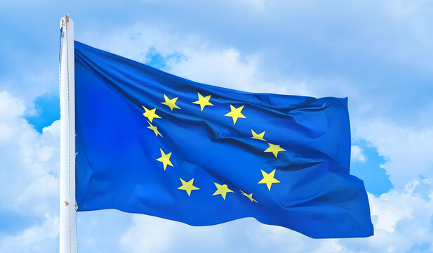 The flag of The European Union flapping in the wind. Economic and finance Community. Politics and Economy. Transnational political government