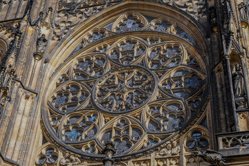 Beautiful aerial and detailed view of St. Vitus Cathedral in Prague Castle, Czech Republic, showcasing Gothic architecture, gargoyles, stained glass, and the historic city skyline.