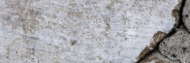 Texture of old cracked concrete wall. Rough gray concrete surface. Wide panoramic background for design.