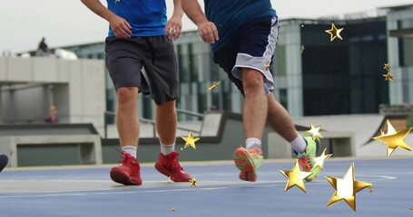 Running two basketball players in jerseys and sneakers on sports court with bench and gold stars