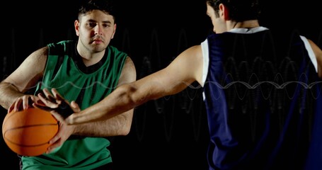 Dribbling man in green jersey holding orange basketball in gym, defender stealing, copy space