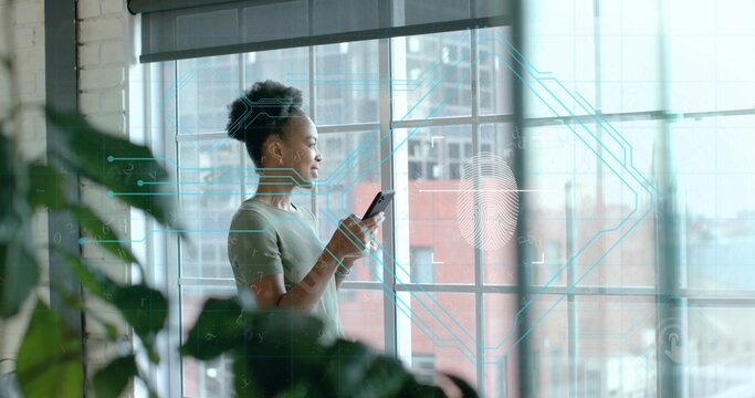Holding smartphone, woman wearing T-shirt by loft window, with potted plant and digital overlay