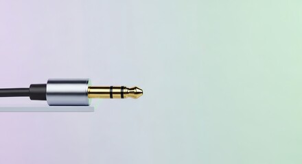 Fototapeta premium Sleek Audio Jack: Silver, Gold, and Black on Gradient Background