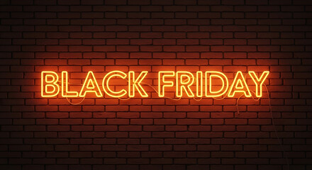 A Black Friday neon sign with a classic horizontal layout, emitting a warm orange glow against a textured brick wall, represents traditional sales events and shopping excitement