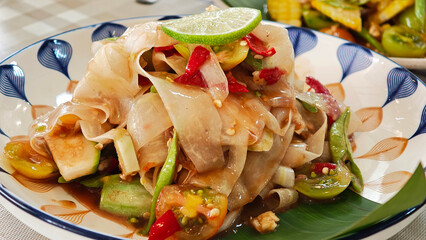 Papaya salad on a plate. Thai food.