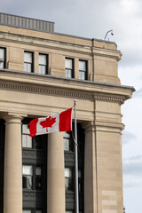 Senate of Canada building with Canadian flag.