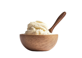 Bowl of white cream w/ wood spoon against black backdrop