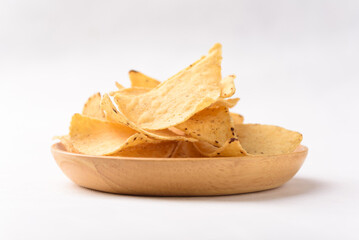 Tortilla chips made from baked corn for Mexican food snack on white background