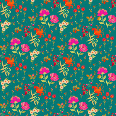Delightful botanical all over print with vibrant red and pink flowers and tiny buds on an emerald background. Beautiful floral embroidery. Seamless fabric print.