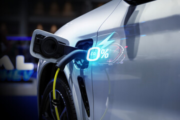 Power cable pump plug in charging power to electric vehicle EV car.