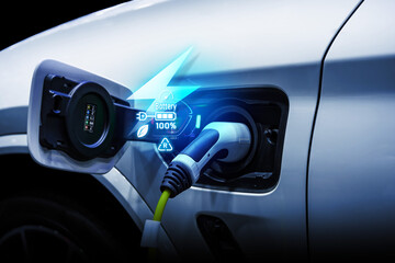 Power cable pump plug in charging power to electric vehicle EV car.