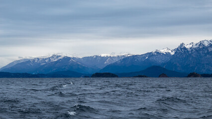 snow covered mountains in winter San Carlos de Bariloche Patagonia Argentina glacial lake Nahuel Huapi, next to the Andes Mountains, base city for skiing in the mountains