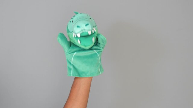 Fun hand puppet show with colorful dinosaur design