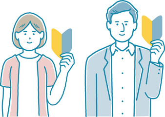 若葉ワークを持っているパーソン　男女