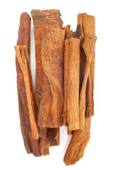Close-up of cinnamon sticks on white background