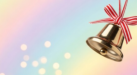 Obraz premium Elegant golden bell with festive red and white ribbon, symbolizing celebration and joy