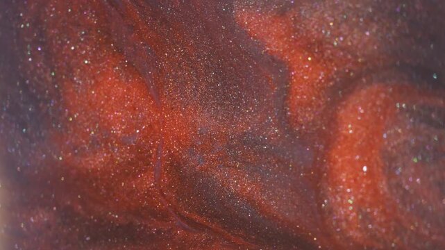 Dye fluid. Blur acrylic stream. Orange gray sparkling emulsion mix ink texture. Defocused hot color lava drip abstract background.