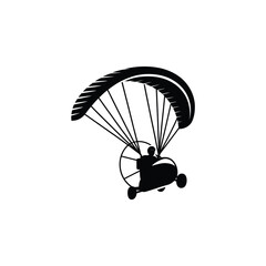 Black silhouette of a powered paraglider in flight