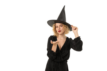 Fototapeta premium Young woman in witch hat, celebrating Halloween, isolated, PNG