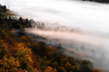 Beautiful misty morning in the fall mountains