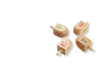 Four colorful dreidels on a white background, isolated, PNG