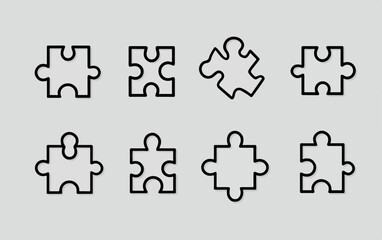 Naklejka premium Set di pezzi di puzzle stilizzati in bianco e nero su sfondo grigio chiaro