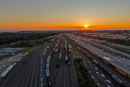Aerial View of a Large Train Yard at Sunset
