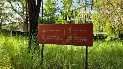 A light brown prohibition sign, a rule before entering in a local cafe. List of coffee shop etiquette rules on clear visual design.

