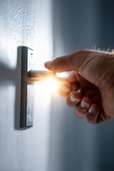 Naklejka premium Person opening a door to light, concept of opportunity