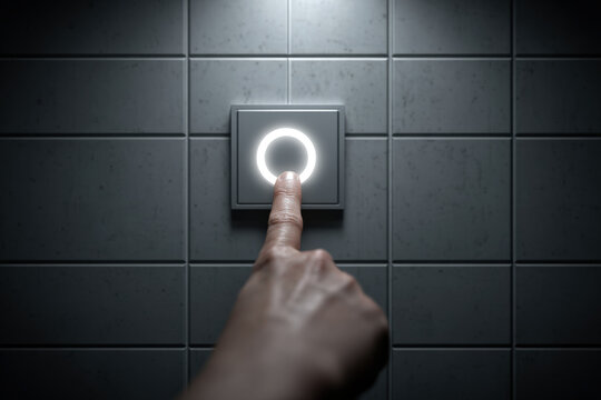 Person highlights blank tile on wall grid with glowing focus ring in dim lighting - Powered by Adobe