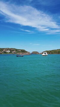 Boats on Ferradura beach - vertical - Buzios Brazil