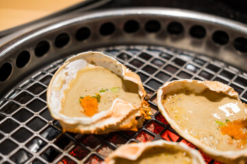 Japanese grilled crab, kani miso yaki, crab miso, cooked in the shell. Selective focus