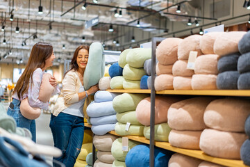 Happy Asian woman family mother and daughter shopping together at department store. Senior mom and adult child choosing and buying gift or home decoration. Mother's day and consumerism concept.