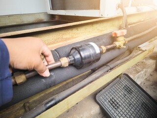 Checking the dryer filter and refrigerant pipe lines of the air conditioning HVAC.