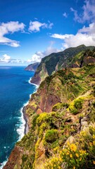 Fototapeta premium Dramatic Coastal Cliffs of Madeira Island Under a Blue Sky.