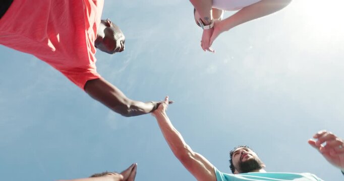 Fitness, friends and people with high five for run success, outdoor training or marathon practice. Teamwork, below and athlete applause to celebrate finish with flare, achievement or support together
