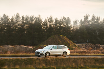 Premium white wagon in rural landscape